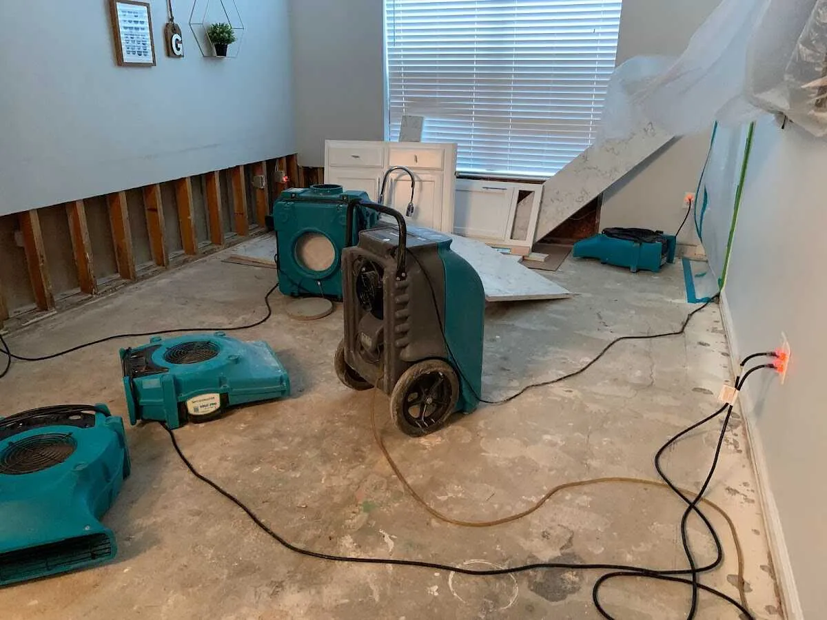 Dehumidifier in flood-cut room for Water Damage Restoration in McDonough